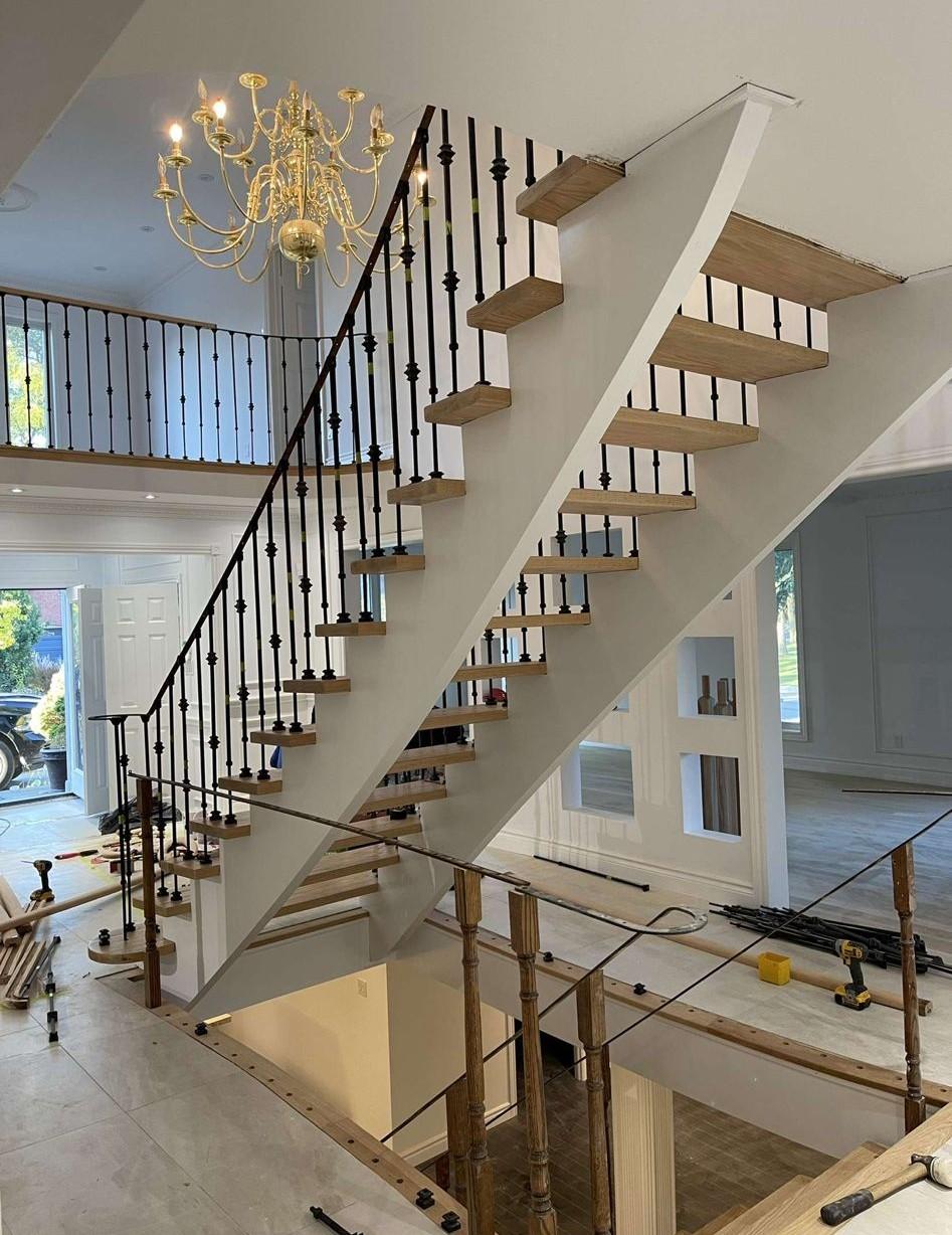 Custom staircase renovation with wood treads in Toronto