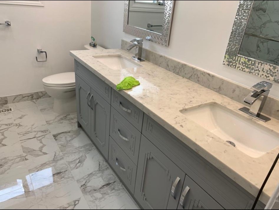 Toronto bathroom renovation with large-format marble porcelain tile flooring and custom double vanity